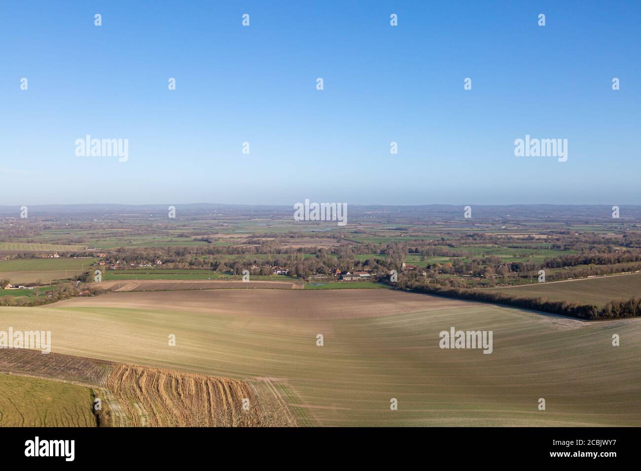Looking out over fields and a vast landscape, from Firle Beacon in the South Downs Stock Photo