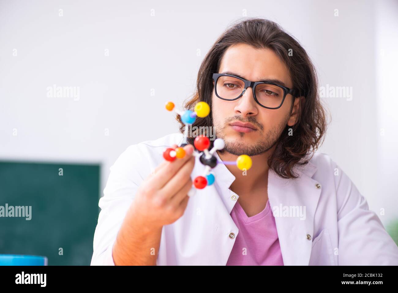 Young physicist in the classroom Stock Photo - Alamy