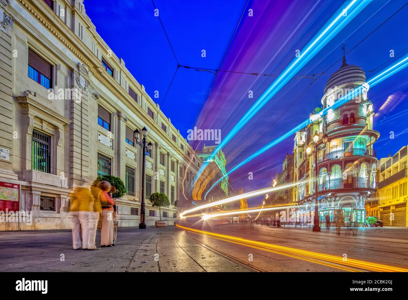 Light trails of a streetcar on Constitution Avenue, Seville, Spain Stock Photo