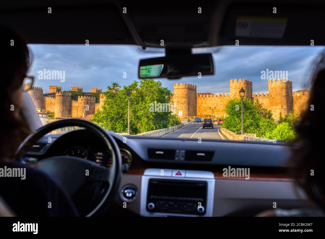 The medieval walls of Avila from a moving car, Spain Stock Photo