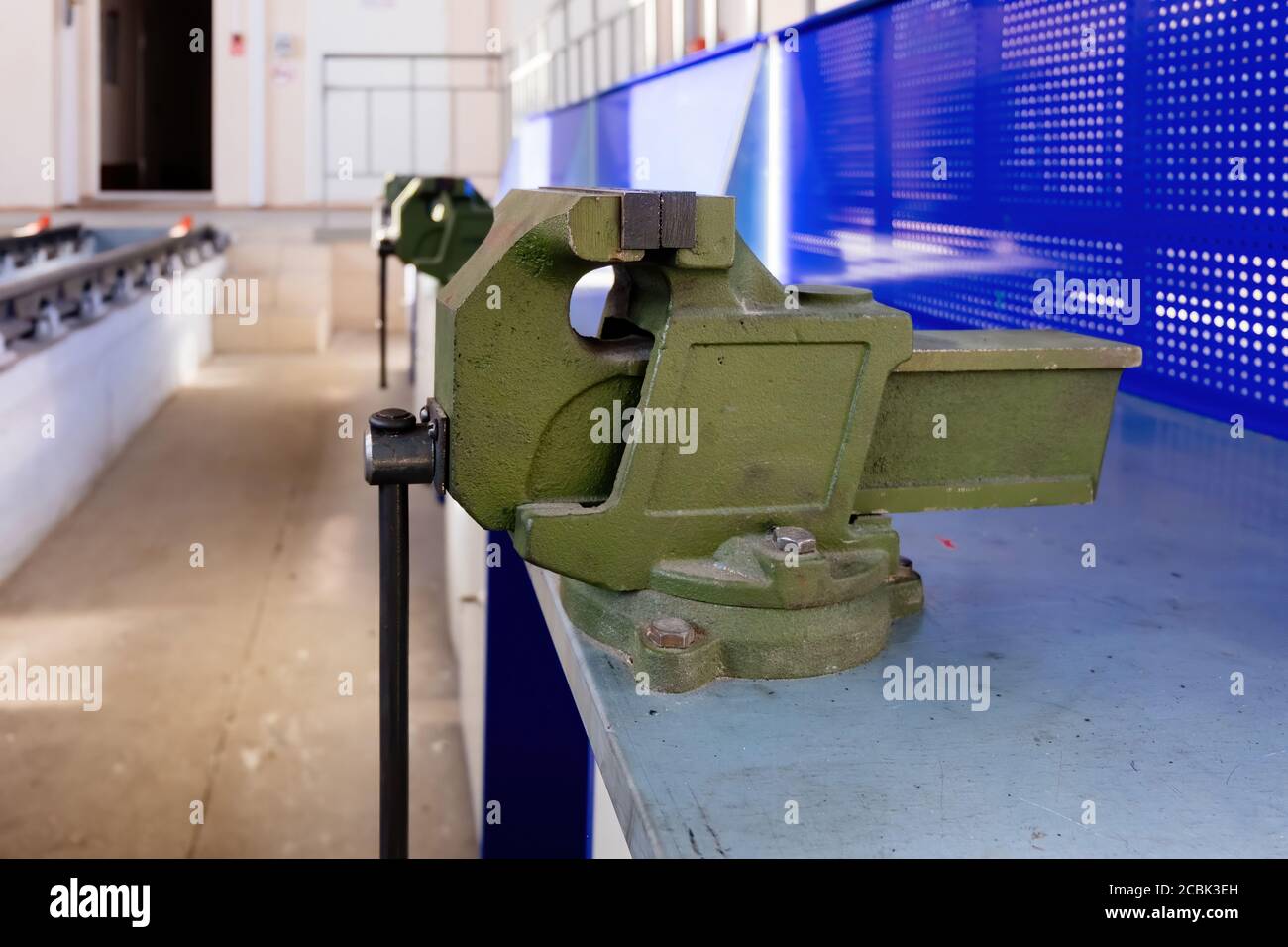Green steel vice in the metalworking Stock Photo Alamy