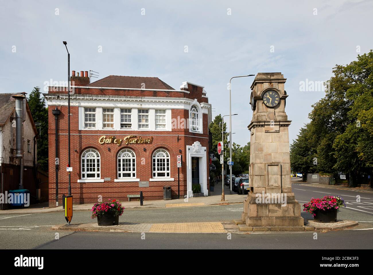Gatley suburban area of  Cheadle, Stockport, Greater Manchester, England, The landmark clock on Gatley road and Church rd junction and Gatley Tandoori Stock Photo
