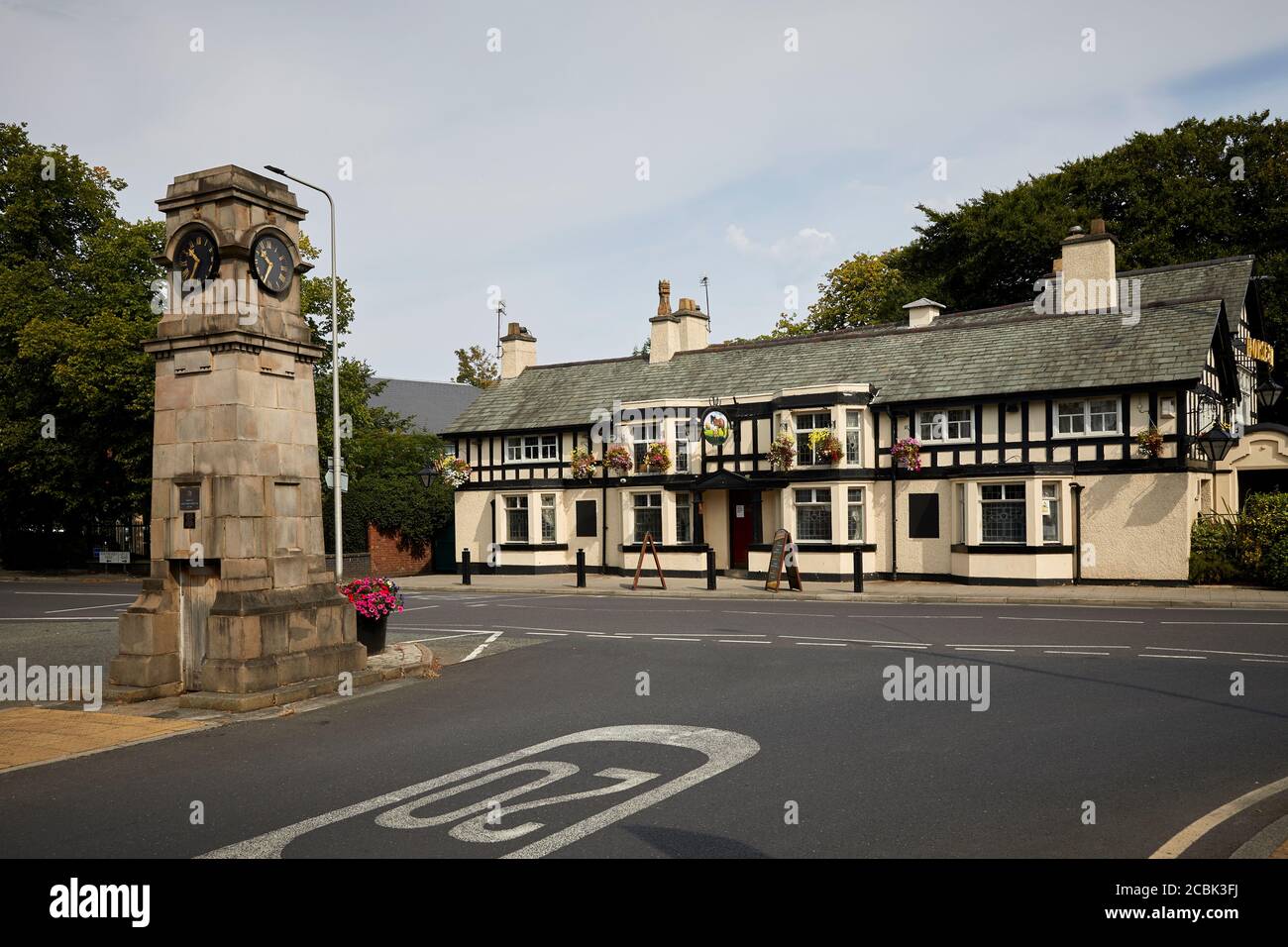 Gatley suburban area of  Cheadle, Stockport, Greater Manchester, England, landmark clock Gatley road and Church rd junction and long pub The Horse & F Stock Photo