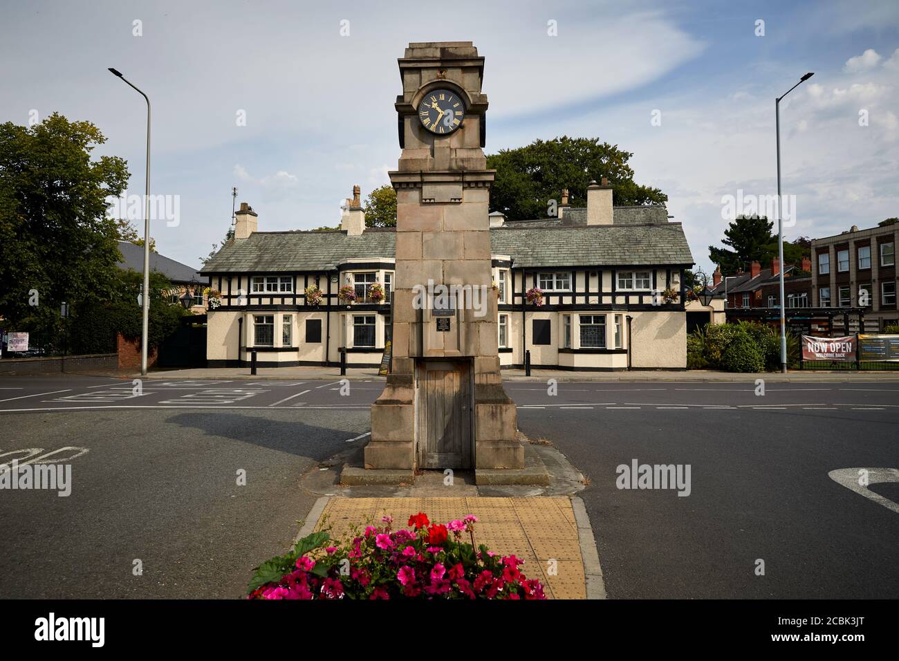 Gatley suburban area of  Cheadle, Stockport, Greater Manchester, England, landmark clock Gatley road and Church rd junction and long pub The Horse & F Stock Photo