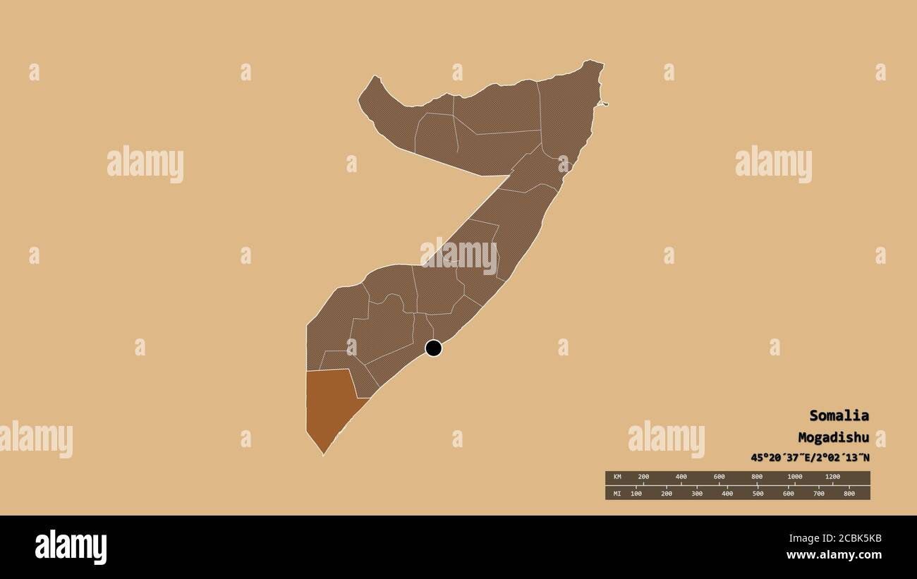 Desaturated shape of Somalia with its capital, main regional division and the separated Jubbada Hoose area. Labels. Composition of patterned textures. Stock Photo