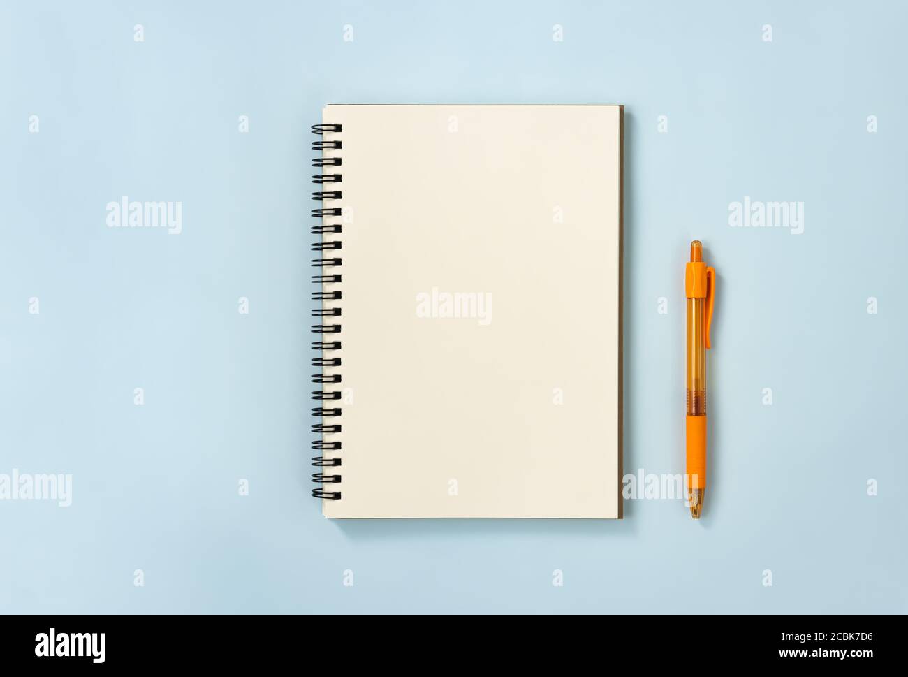 Spiral Notebook or Spring Notebook in Unlined Type and Orange Pen on