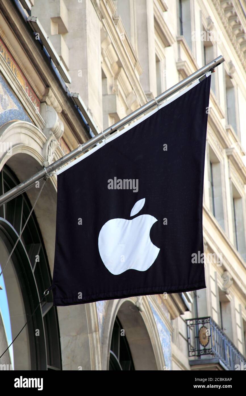 London, United Kingdom, May 8, 2011 : Apple computer advertising logo sign flag flying outside their new flagship store business in Regents Street whi Stock Photo