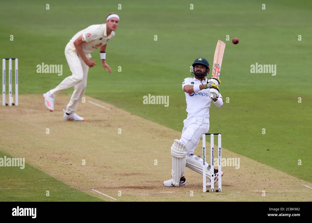 Pakistan's Mohammad Rizwan batting against the bowling of England's Stuart Broad (left) during day two of the Second Test match at the Ageas Bowl, Southampton. Stock Photo