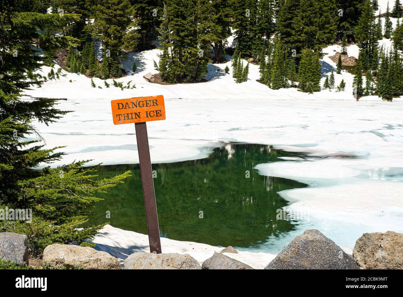 Thin Ice danger sign at Lake Helen, Lassen National Forest, California Stock Photo