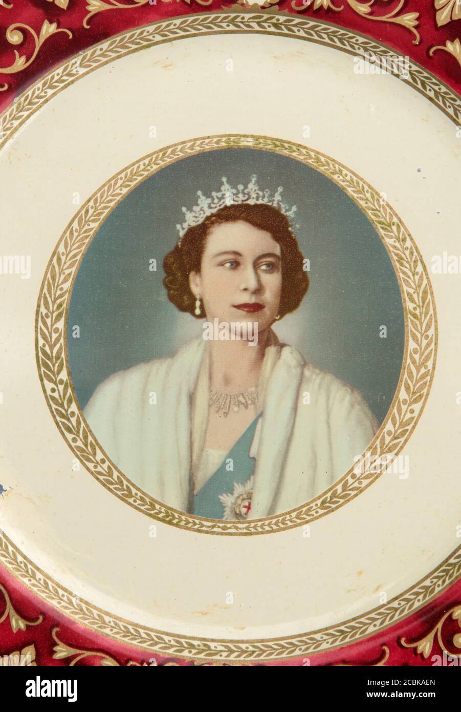 Queen Elizabeth II Coronation 2 June 1953 portrait on a souvenir vintage Portland Ware tin plate. The young Queen Elizabeth HOMER SYKES Stock Photo