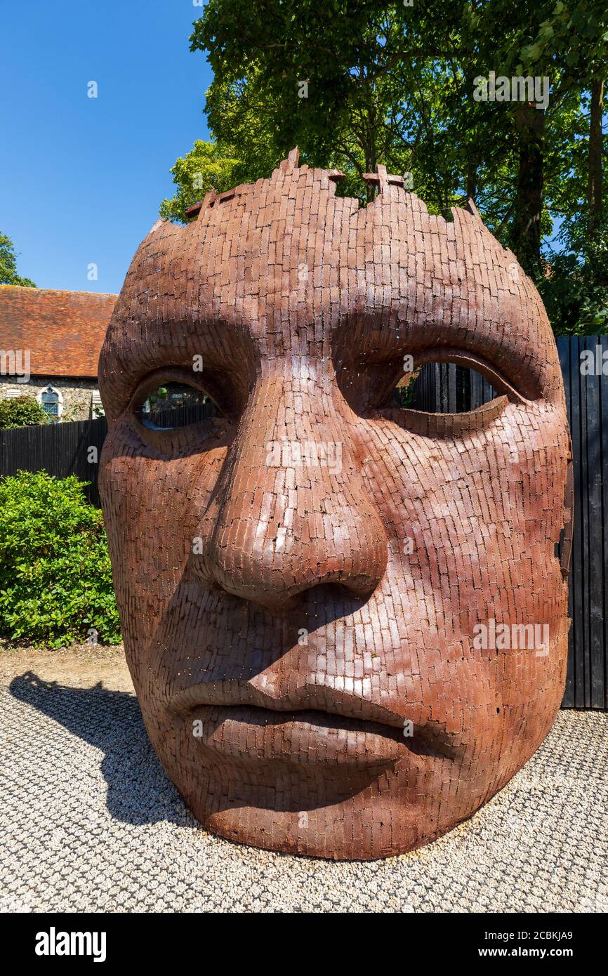 The Iron Face sculpture along the Great Stour outside the Marlowe Theatre, Canterbury, Kent, England Stock Photo