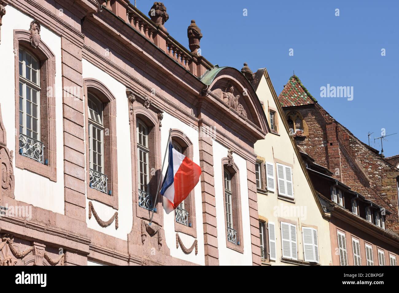 French flag on the building of district court in Colmar, France in downtown. Stock Photo