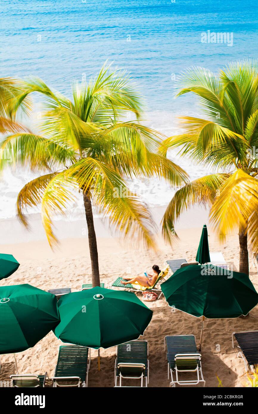Woman relaxing on tropical beach Stock Photo - Alamy