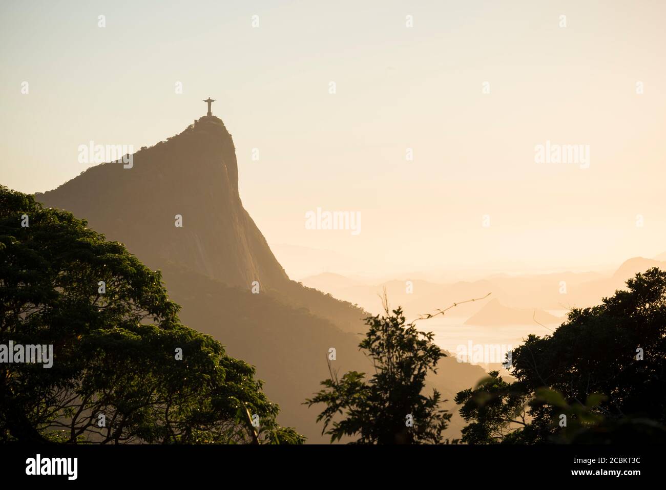 Distant view of Christ the Redeemer at sunset, Rio De Janeiro, Brazil Stock Photo