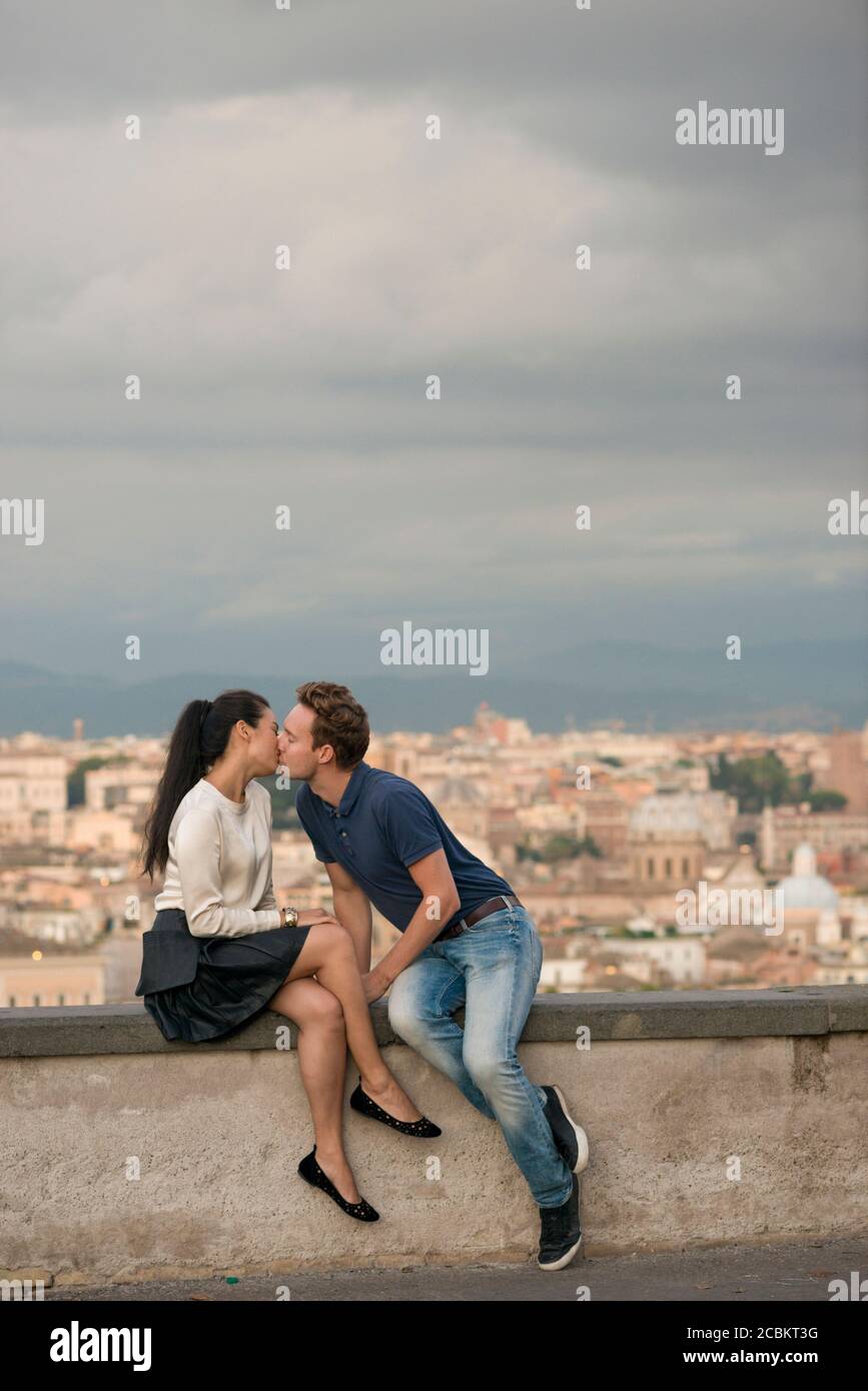 Couple kissing on Gianicolo Hill at sunset, Rome, Italy Stock Photo