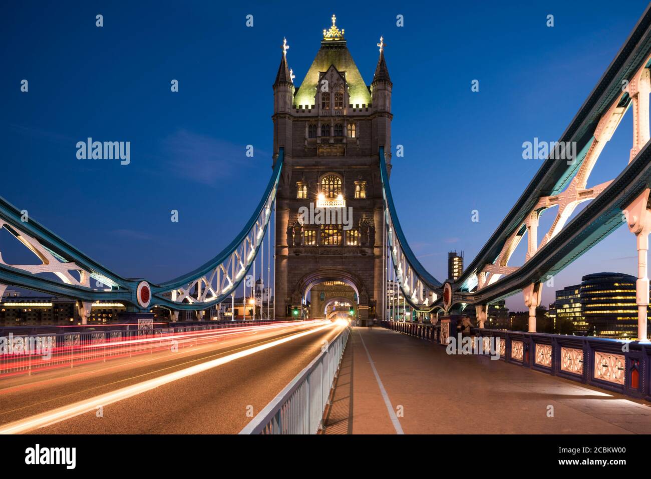 View of traffic light trails on Tower Bridge at night, London, UK Stock ...