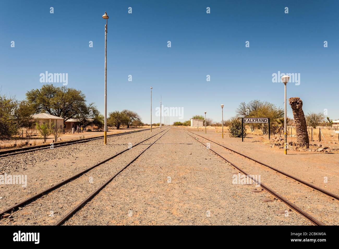 Sign fo Kalkrand village on empty railway track, Hardap Region, Namibia Stock Photo