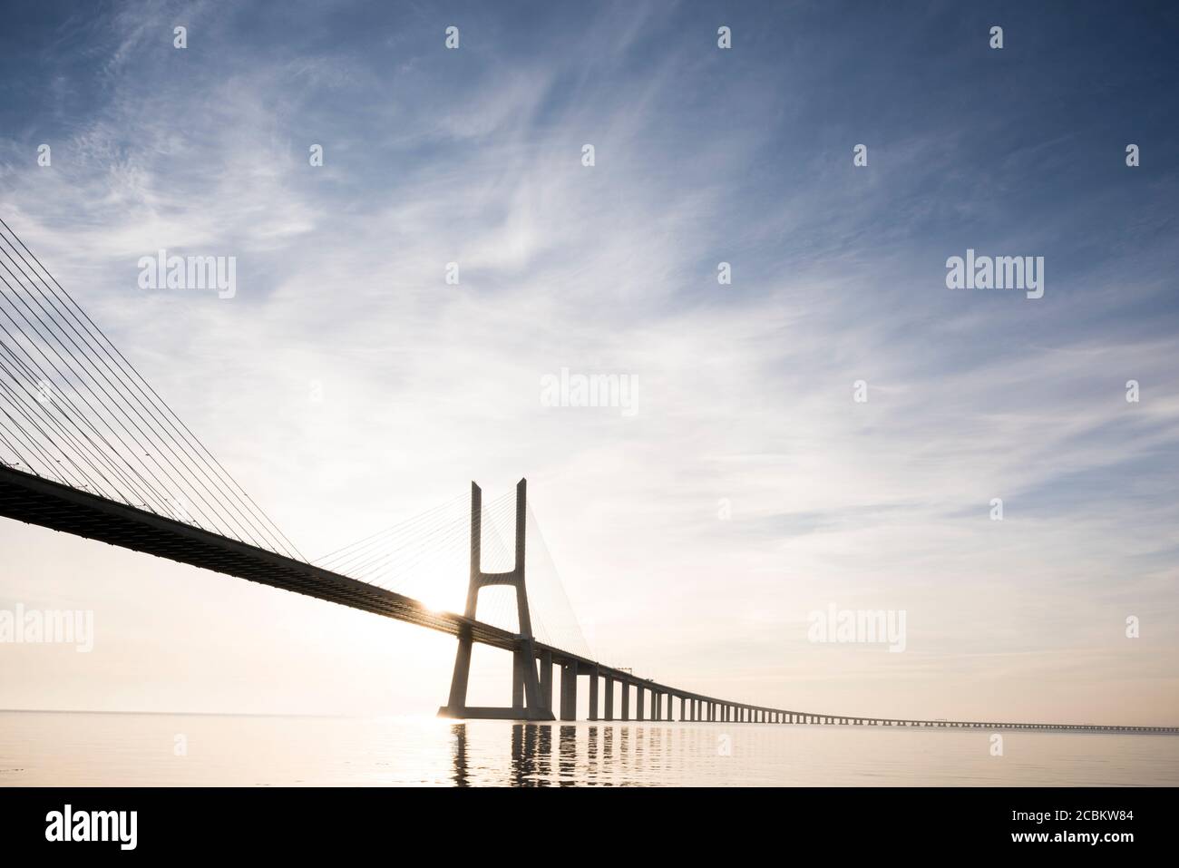 Vasco Da Gama Bridge against dramatic sky, Tagus River, Lisbon, Portugal Stock Photo