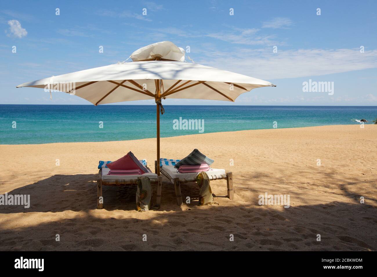 Beach chairs and umbrella on beach, Lake Malawi, Malawi Stock Photo