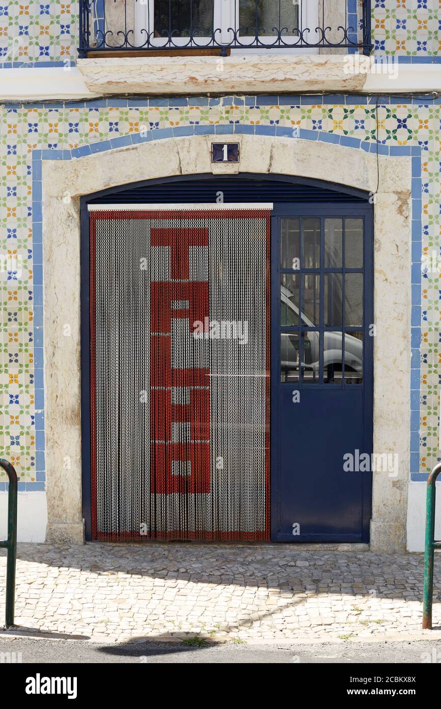 Doorway with wall tile surround on facade, Lisbon, Portugal Stock Photo
