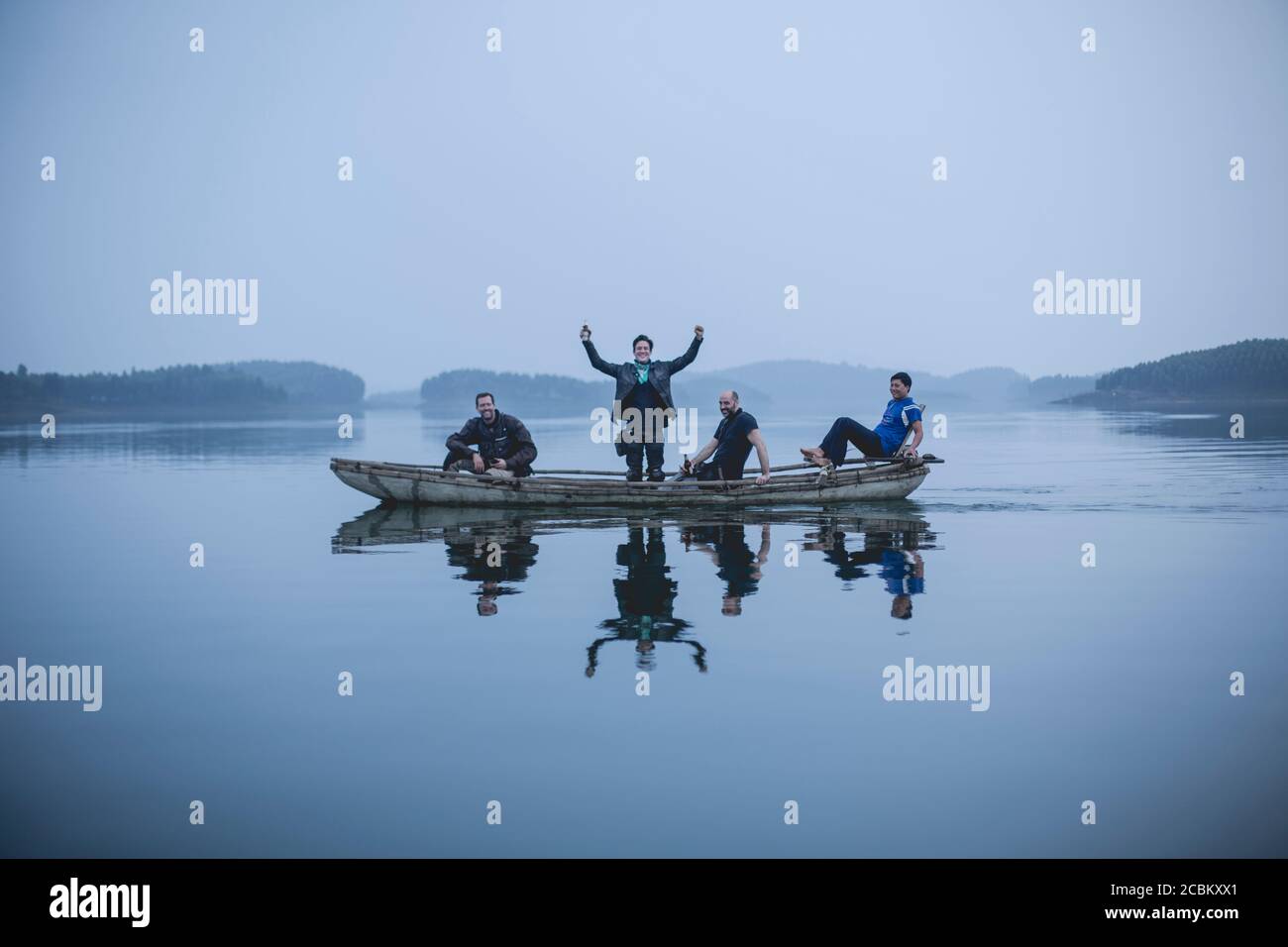 Men on a boat ride, Vietnam Stock Photo - Alamy