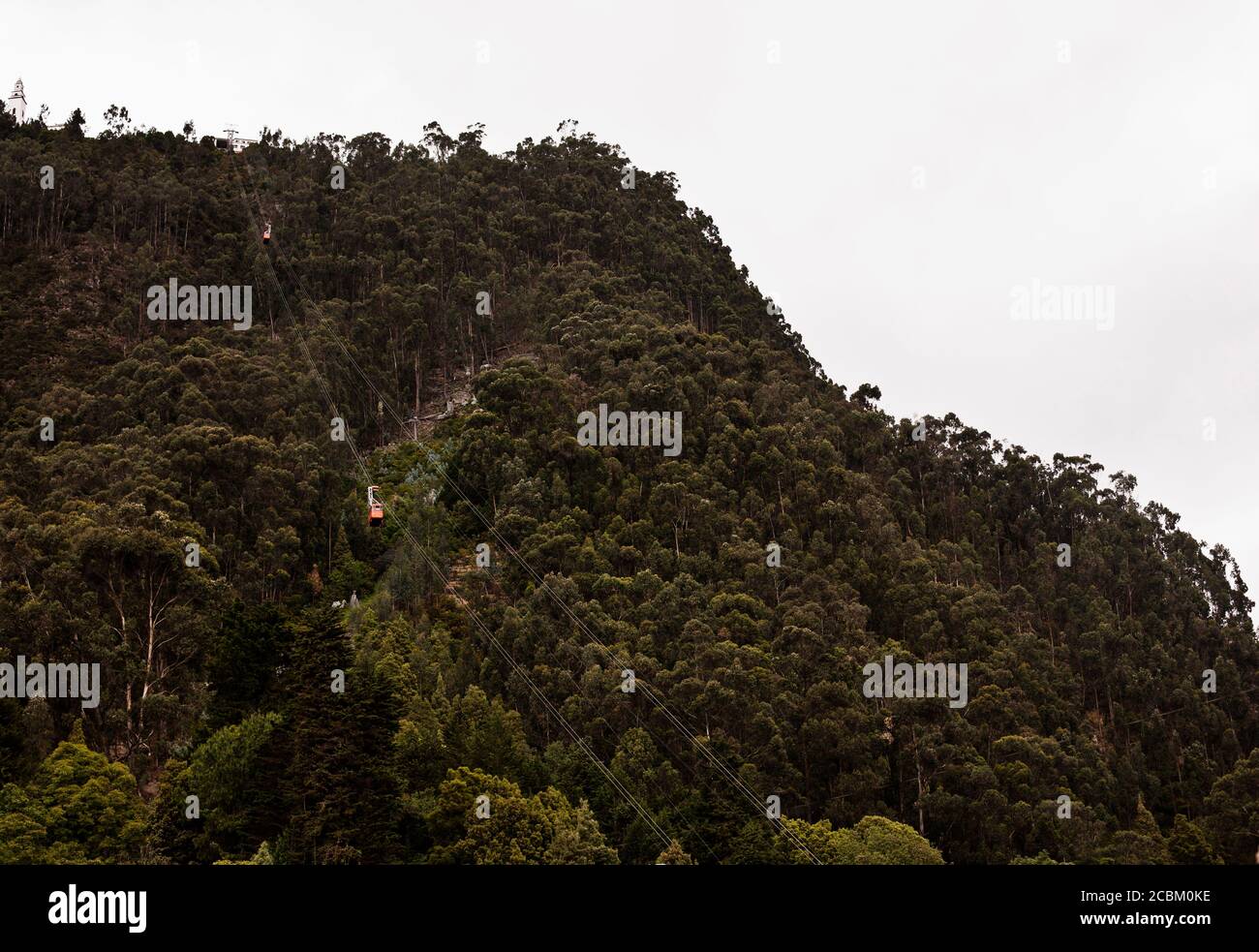 View of cable car moving up Monserrate mountain in Bogota, Colombia, South America Stock Photo