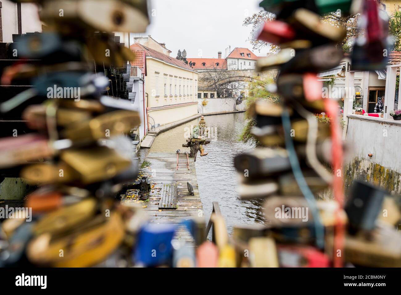 Padlocks attached to fence near John Lennon wall, Prague, Czech Republic Stock Photo
