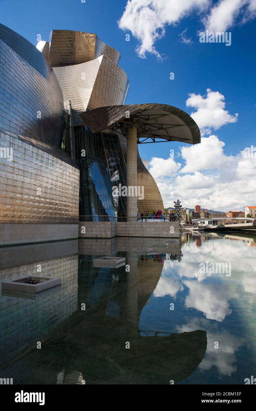 Guggenheim museum and reflection in water, Bilba, Spain Stock Photo