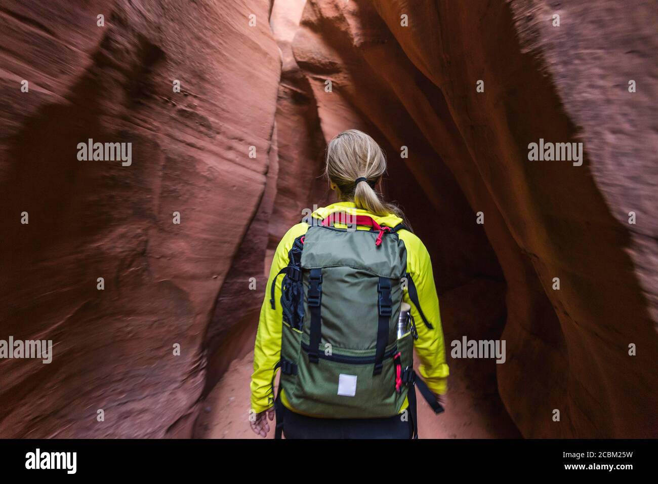 Woman exploring slot canyon Grand Staircase-Escalante National Monument, Utah, USA Stock Photo