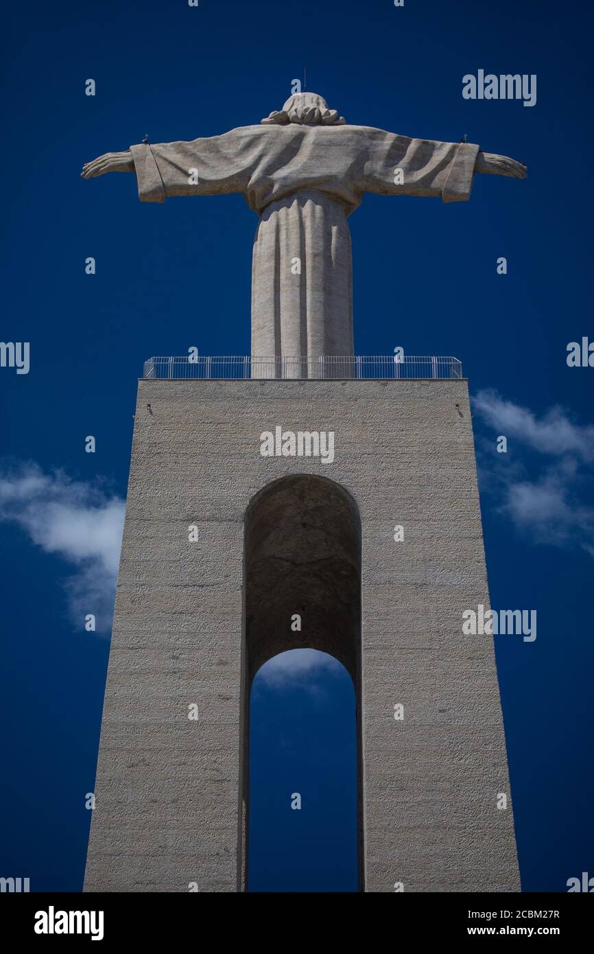 Low angle rear view of statue of Sanctuary of Christ the King, Lisbon, Portugal Stock Photo