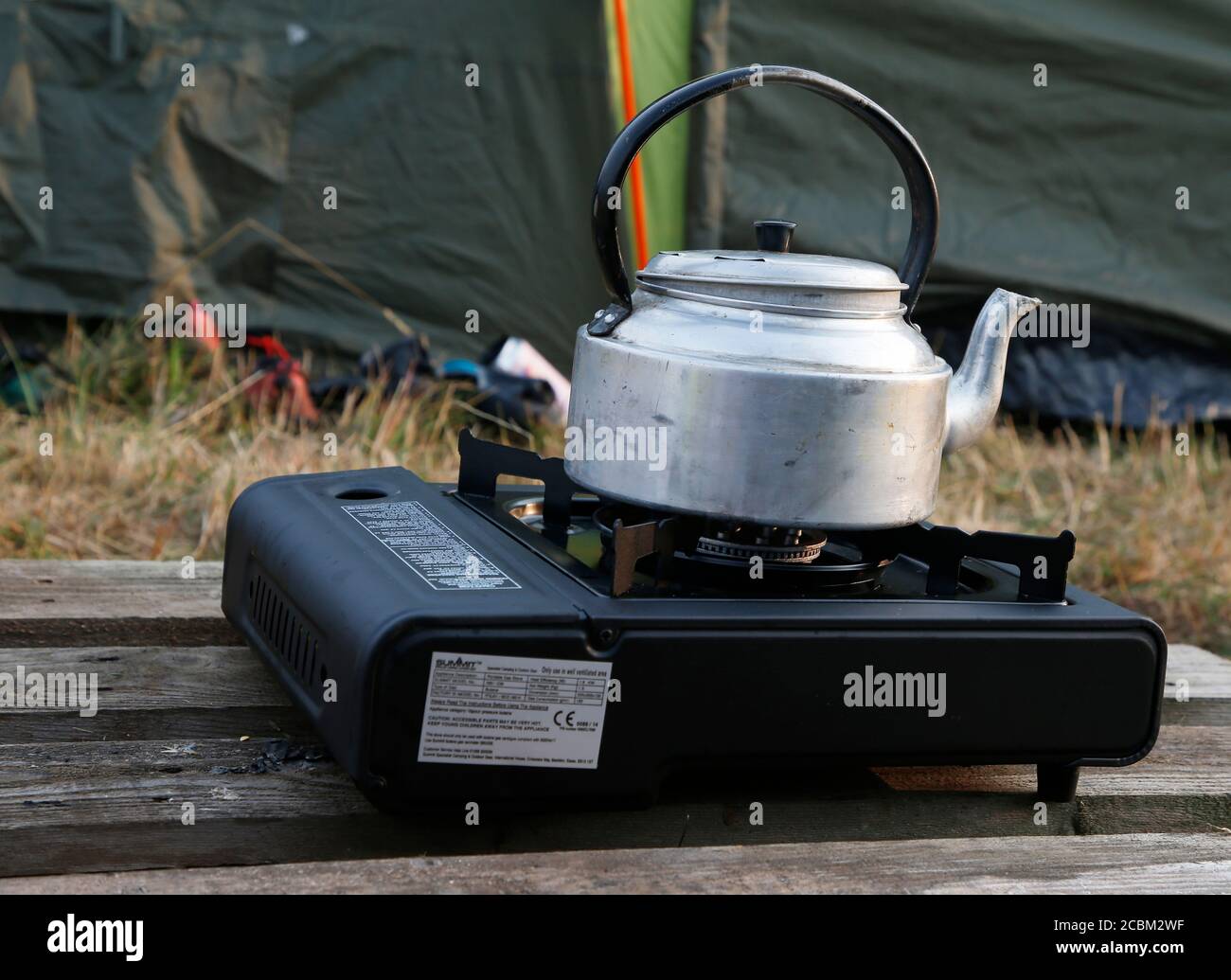 A kettle boiling on a portable stove Stock Photo