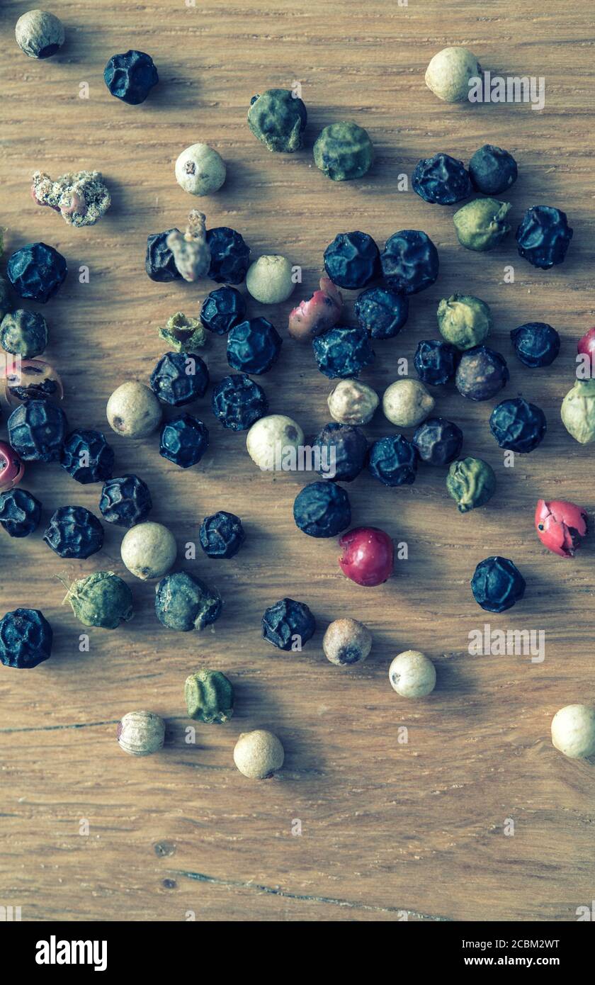 Macro shot of peppercorns on a kitchen work surface Stock Photo
