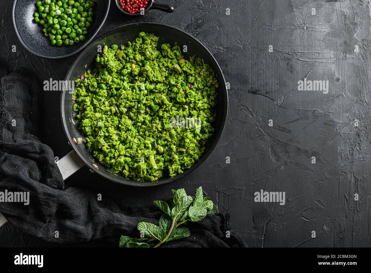 mushy peas gluten free cooked frying pan and peas in bowl with mint