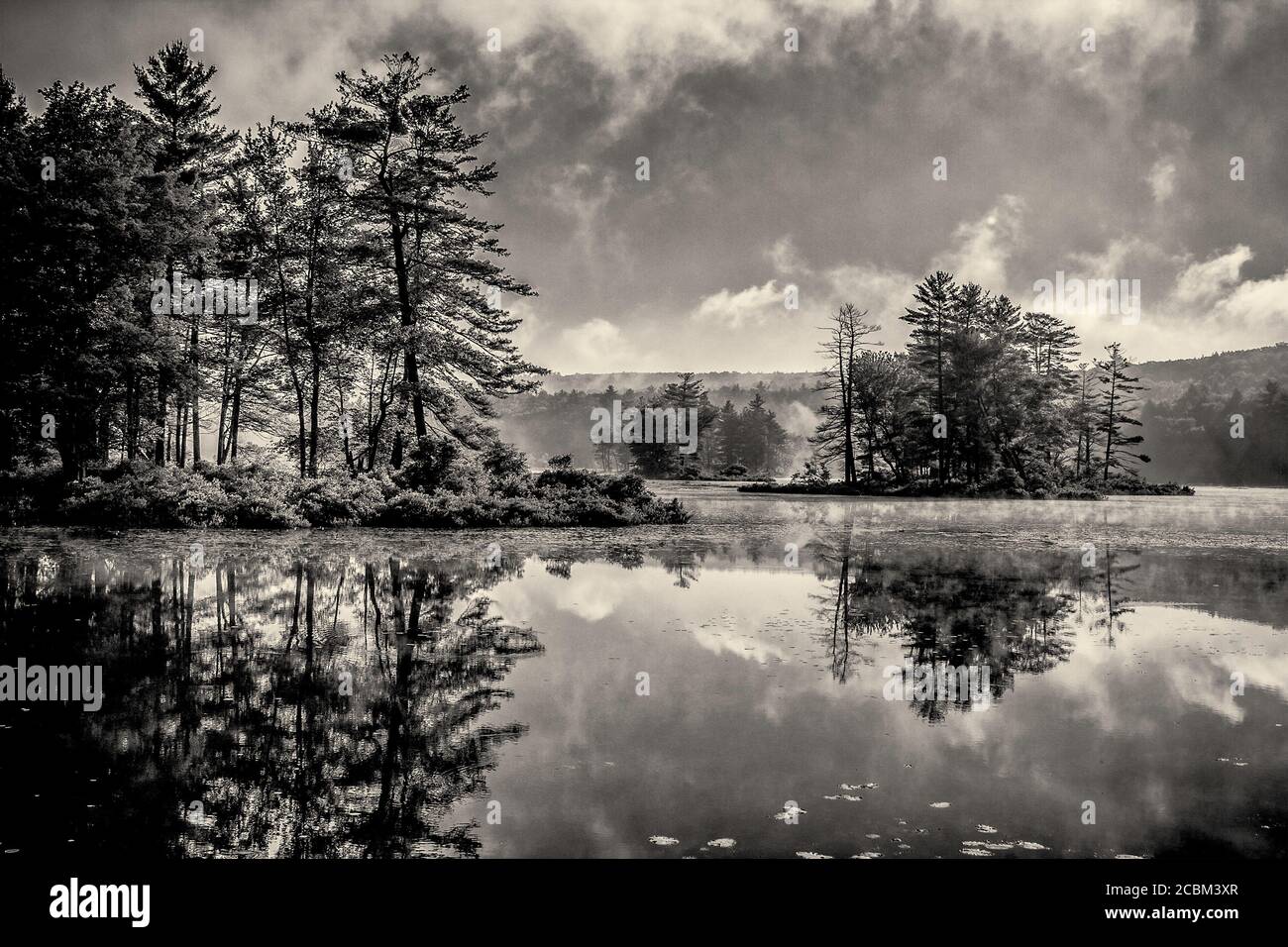 A black and white photograph of Harvard Pond in Petersham, Massachusetts Stock Photo