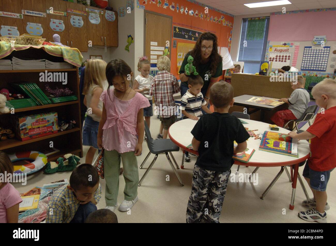 Mabank, Texas USA, August 21, 2006 A kindergarten teacher works with