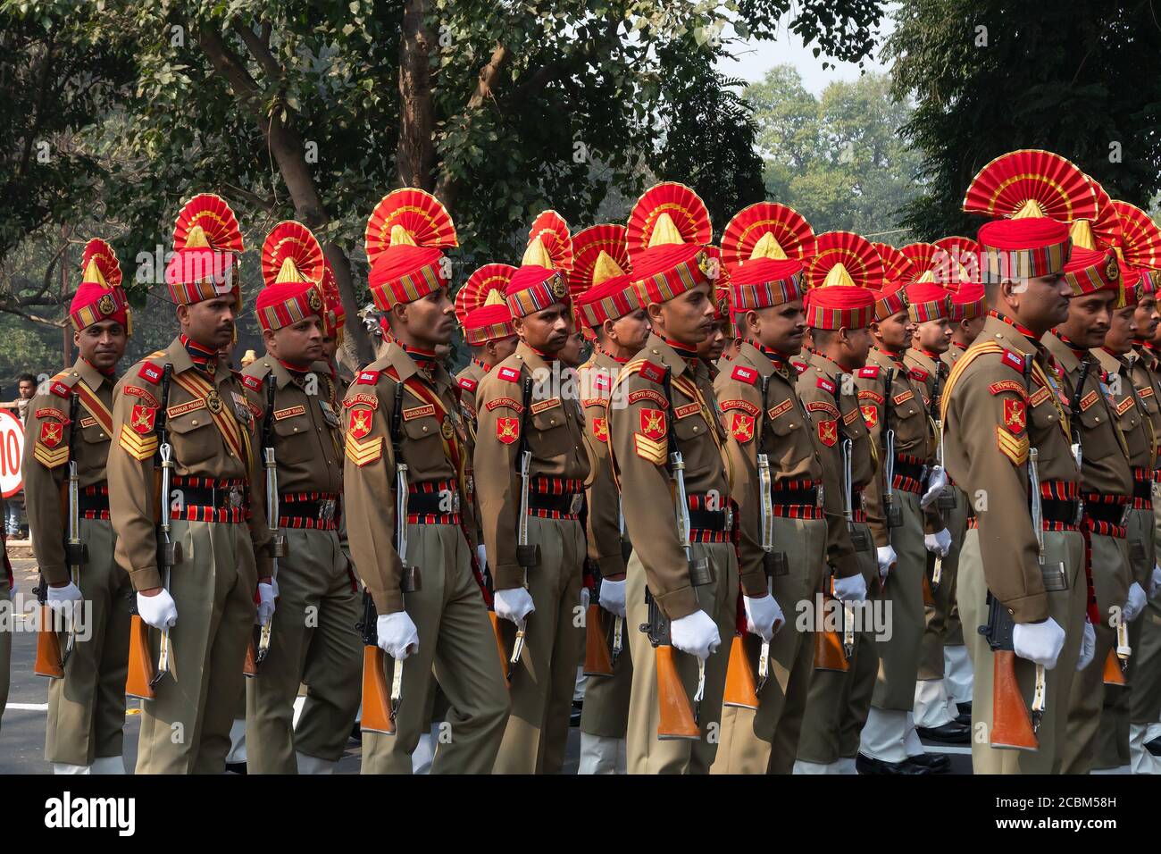 Kolkata, West Bengal, India - 26th Januaray 2020 : Bright and beautiful orange hats of Indian Army Officers , while marching past with rifles. Stock Photo