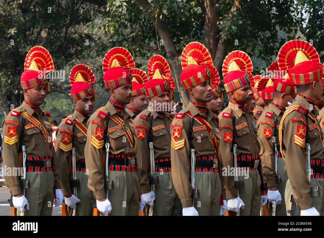Kolkata, West Bengal, India - 26th Januaray 2020 : Bright and beautiful orange hats of Indian Army Officers , while marching past with rifles. Stock Photo