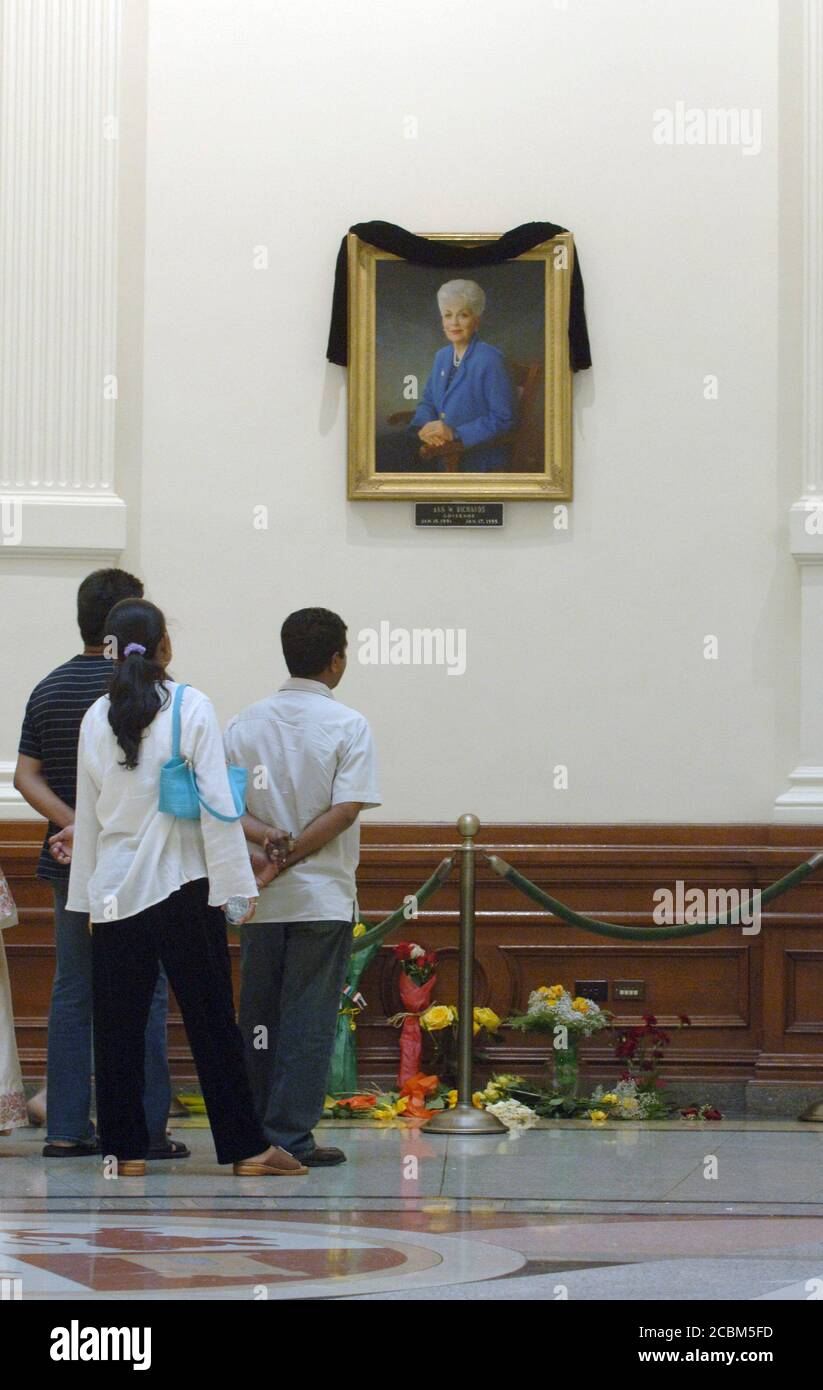 Austin, Texas September 15, 2006: Tourists view a small memorial below the official portrait of former Texas Governor Ann Richards in the rotunda of the Texas Capitol Friday afternoon. Richards,73,  known for her down-home humor and political savvy, died Wednesday in Austin. ©Marjorie Cotera / Daemmrich Photo / Stock Photo