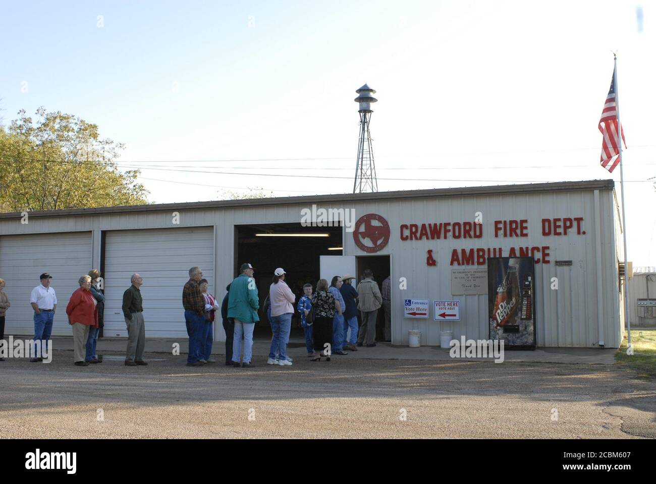 Crawford, Texas USA, November 7, 2006: Crawford residents line up at the fire station to vote about an hour after U.S. President George W. Bush voted at 7 AM in the U.S. mid-term elections. ©Bob Daemmrich Stock Photo