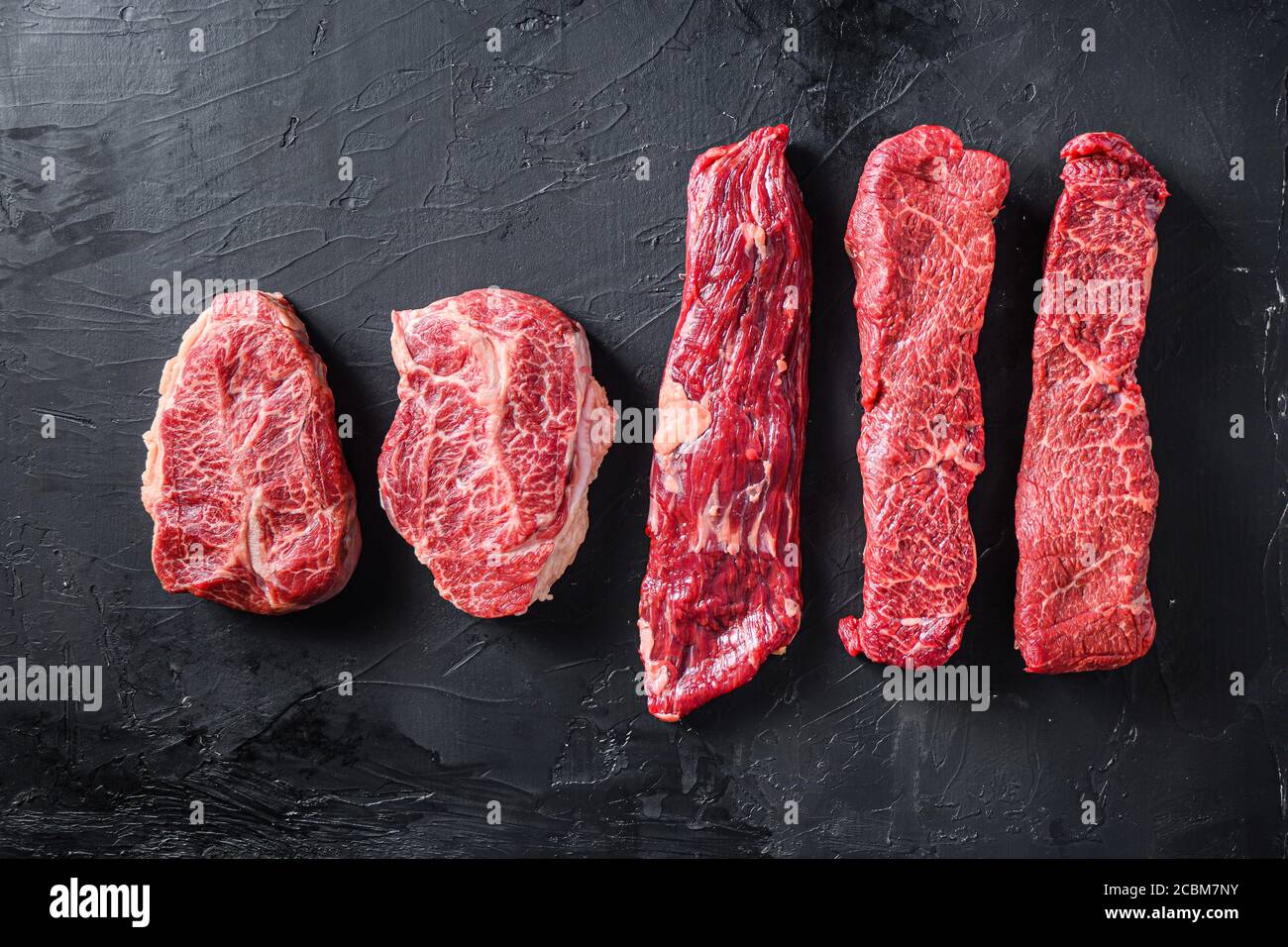 Raw organic meat Top Blade steaks near machete and denver steak ...