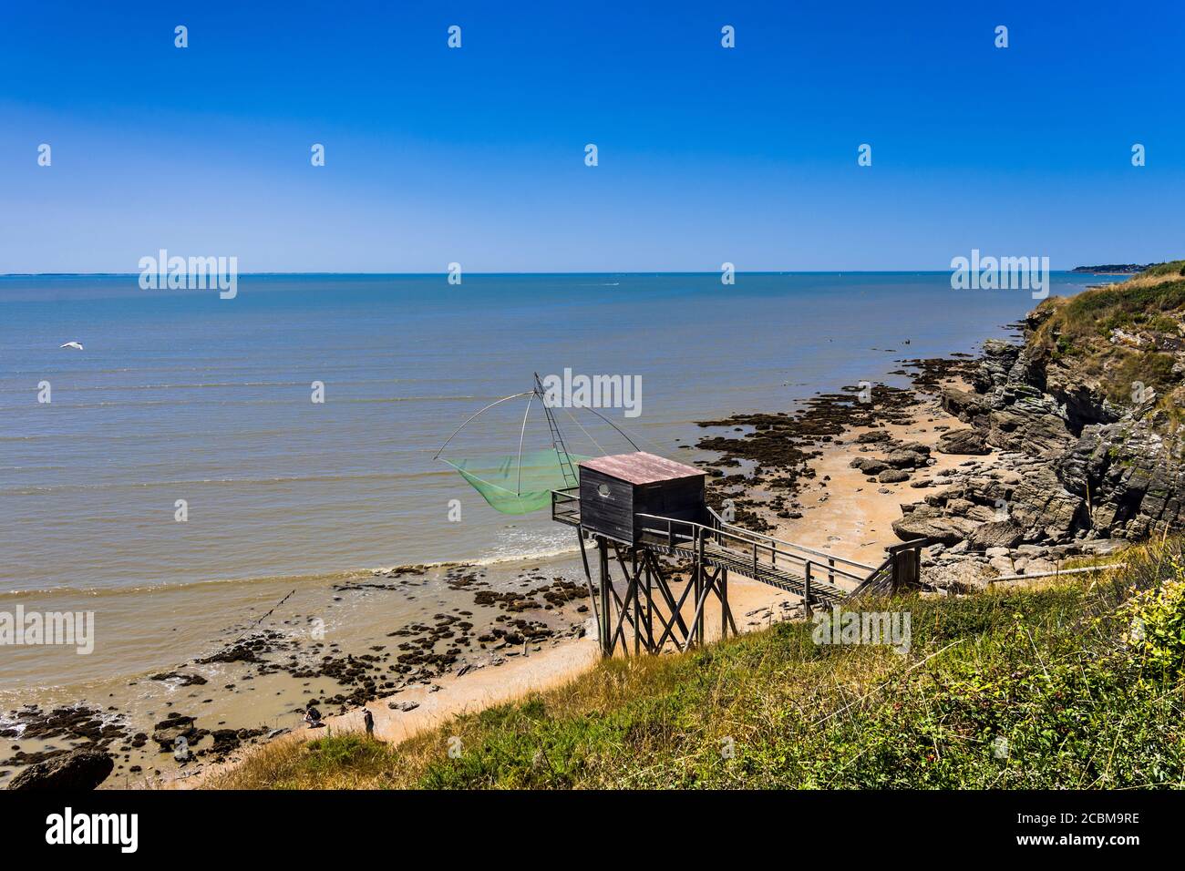 Fisherman's traditional hut and net at Plage de la Fontaine aux Bretons