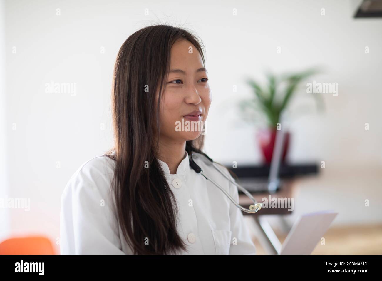 young asia female doctor with report in a practice Stock Photo