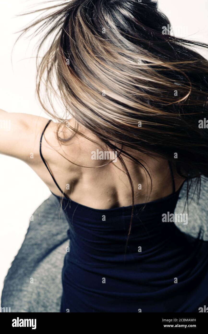 Young woman dancing with flying hair in a flying dress Stock Photo - Alamy