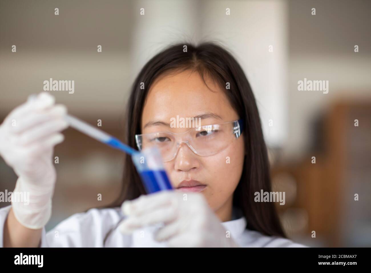 scientist female with lab glasses and tubes in a lab Stock Photo Alamy