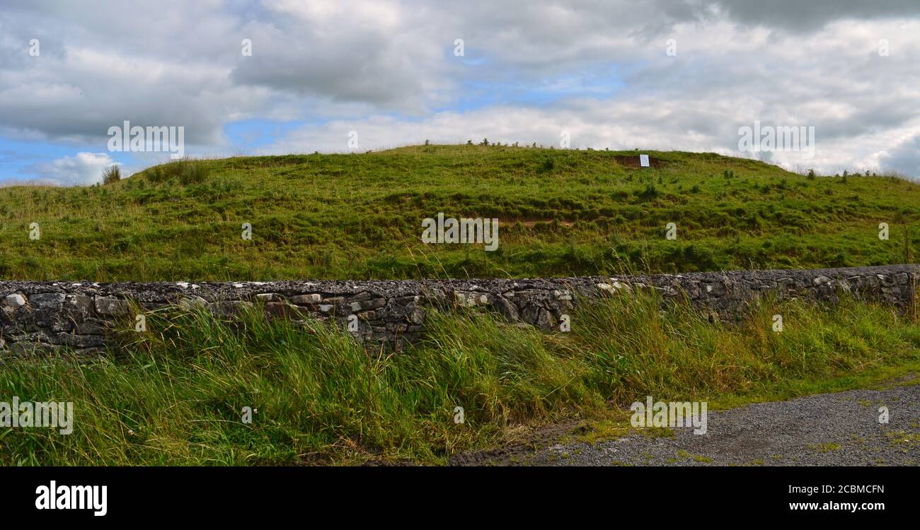 East view, from the road, of the ring barrow known as Rathbeg, a likely ancient burial site. Stock Photo