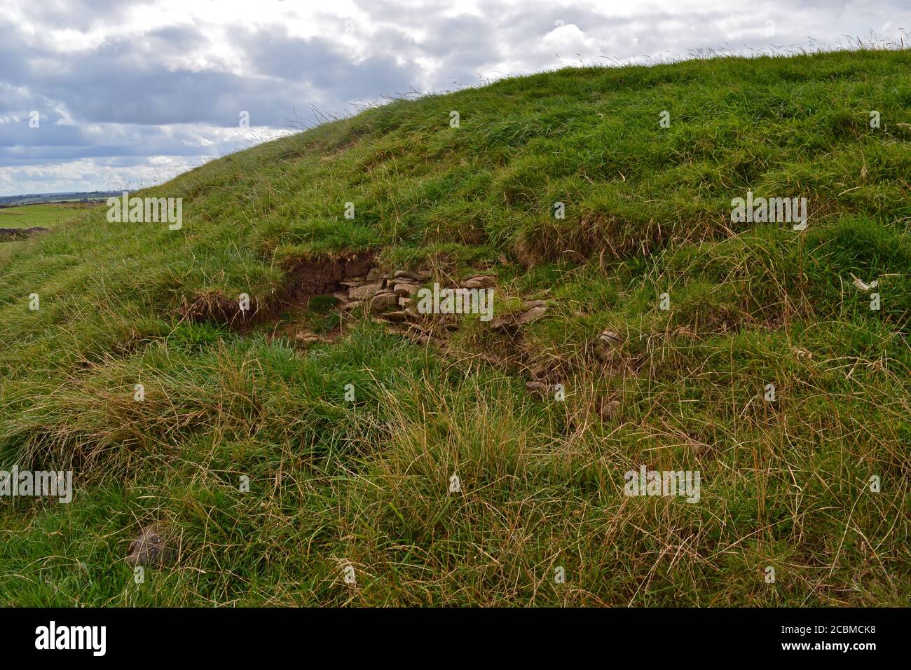The Rathcroghan mound showing stonework that once encircled the original mound and would have given it a much steeper perimeter. Stock Photo