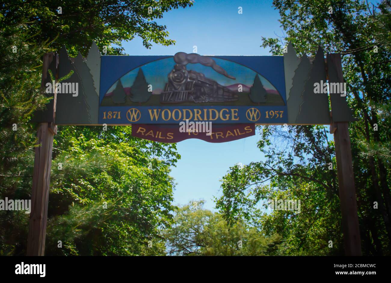 WOODRIDGE, NY, UNITED STATES - Jun 17, 2020: Woodridge, NY / USA - 06/16/2020: Woodridge Rails to Trails Carved Wooden Entrance Sign of Historic Train Stock Photo