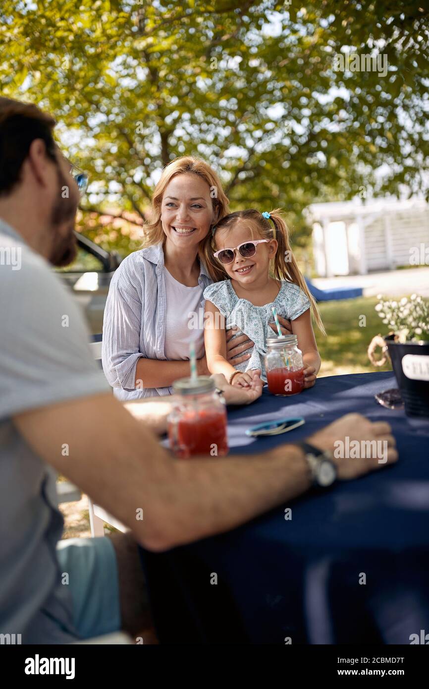 Young man sitting picnic table hi-res stock photography and images - Alamy