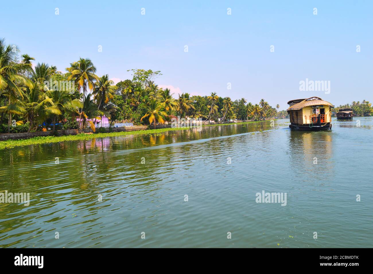Travelling in a houseboat in Alleppey is an enchanting experience in itself. The cool breeze, occasional migratory birds make unique experience. Stock Photo