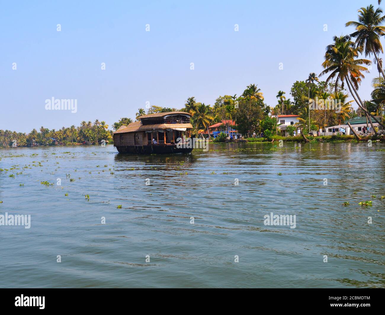 Travelling in a houseboat in Alleppey is an enchanting experience in itself. The cool breeze, occasional migratory birds make unique experience. Stock Photo